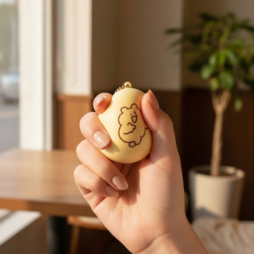 Kawaii Bear Squishy Keychain on bag – worn as bag charm backpack accessory slow-rise squishy stress toy K-beauty lifestyle gift