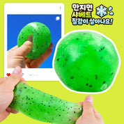 Green kiwi slime being squeezed in hand with crunchy texture