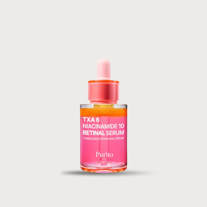Purito TXA Retinal Serum orange capsules close-up – encapsulated retinal visible in pink serum shake before use Korean