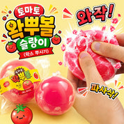 Tomato Crunch Squishy in clear capsule packaging